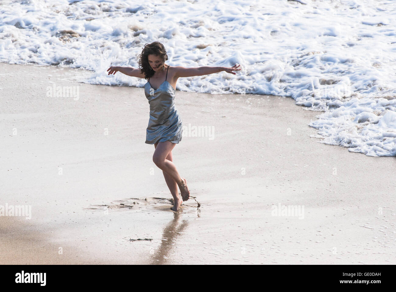Woman dancing beach alone hi-res stock photography and images - Alamy