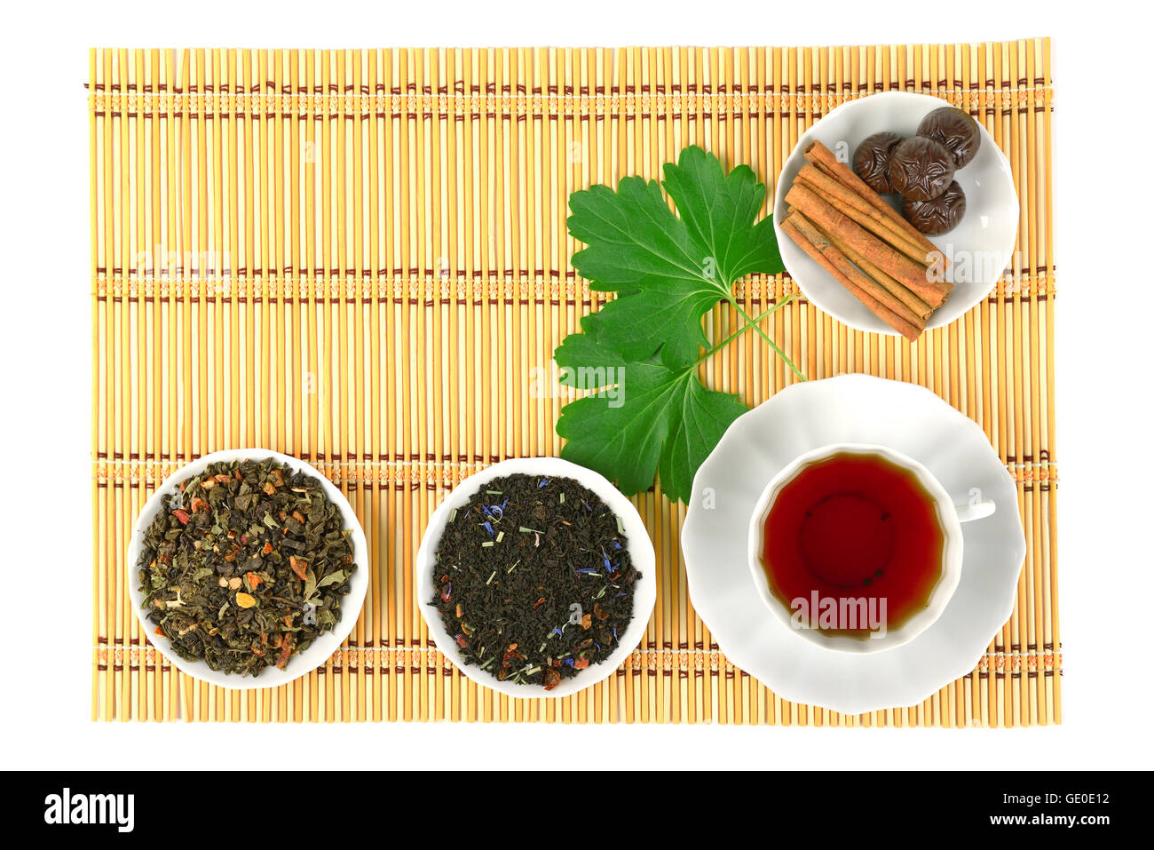 Hot tea with spices on a bamboo mat background Stock Photo