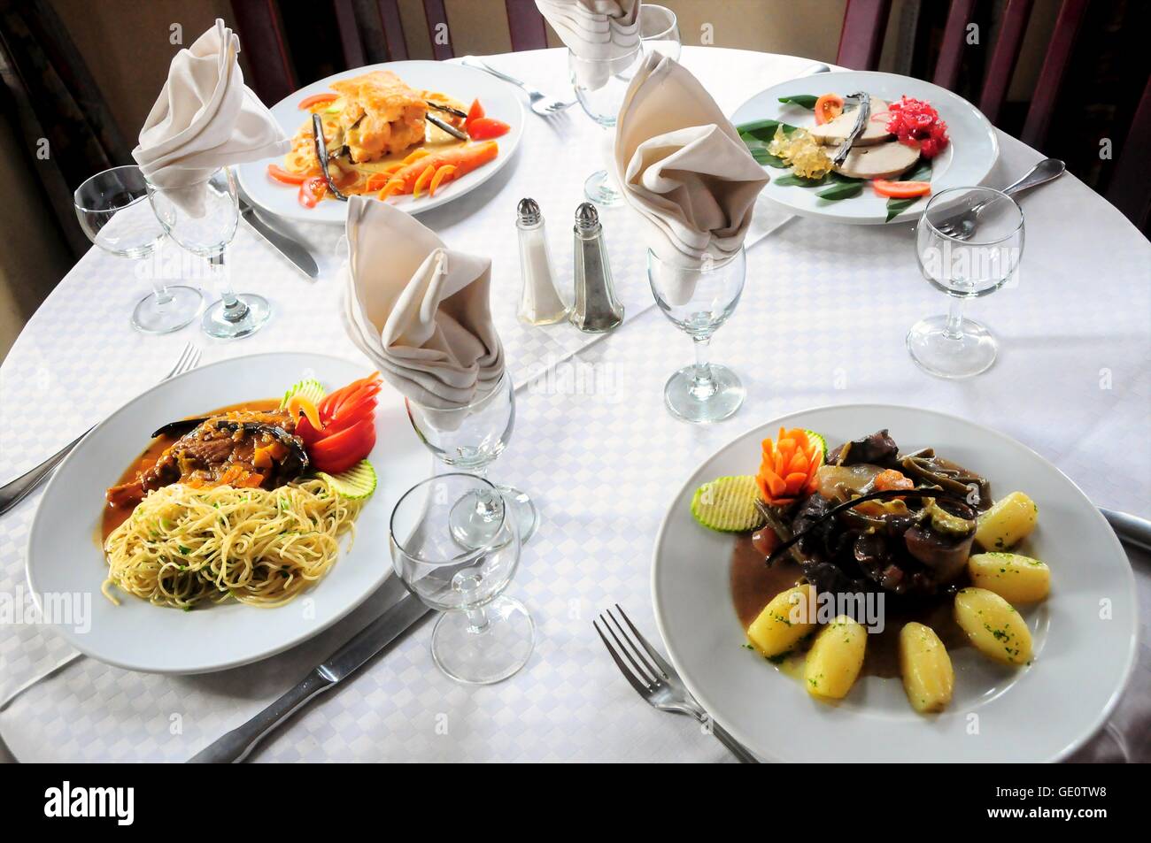 Four savory dishes including vanilla duck with noodles, shrimp puff