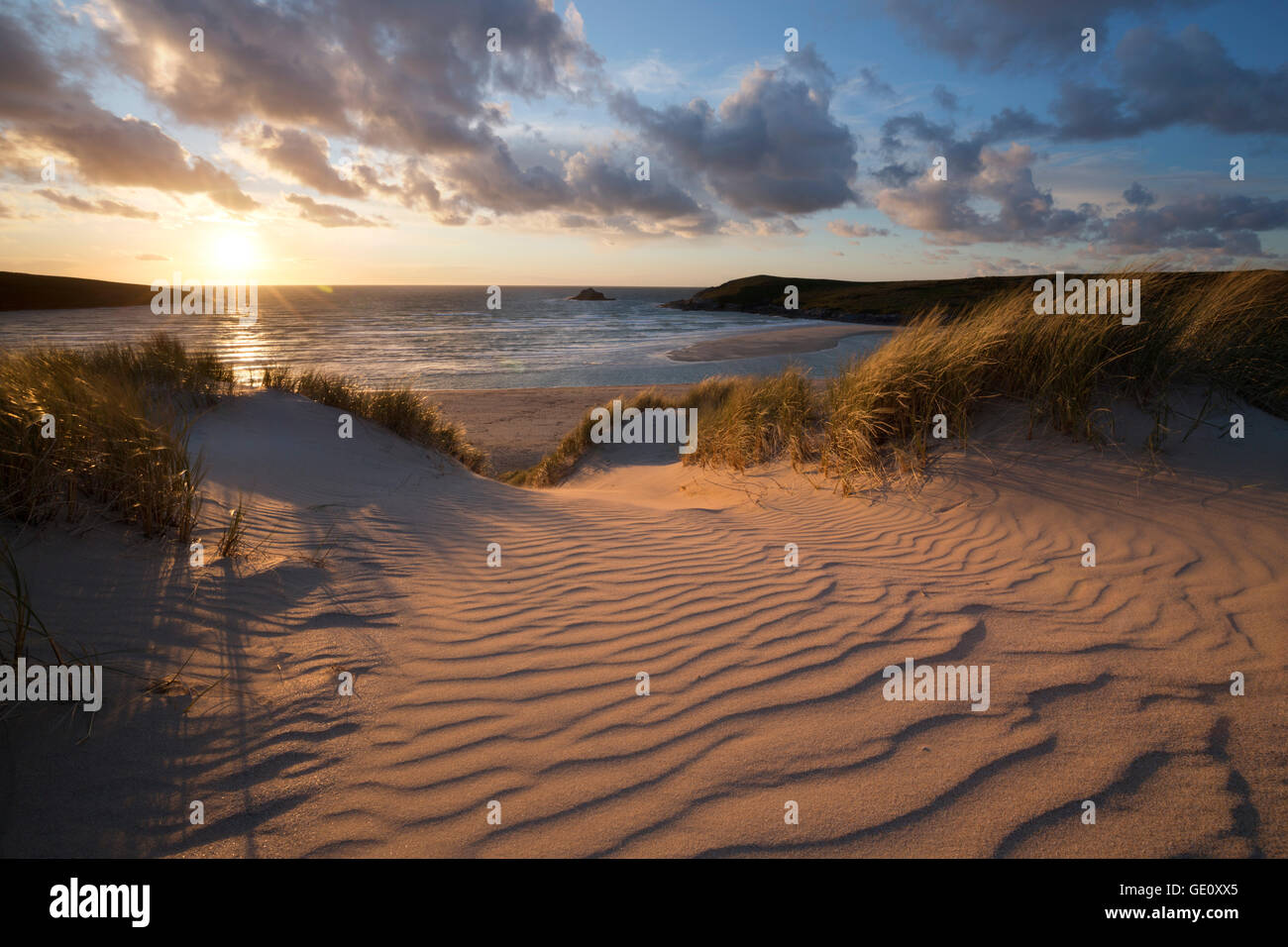 Ribbed sand and sand dunes at sunset, Crantock beach ...
