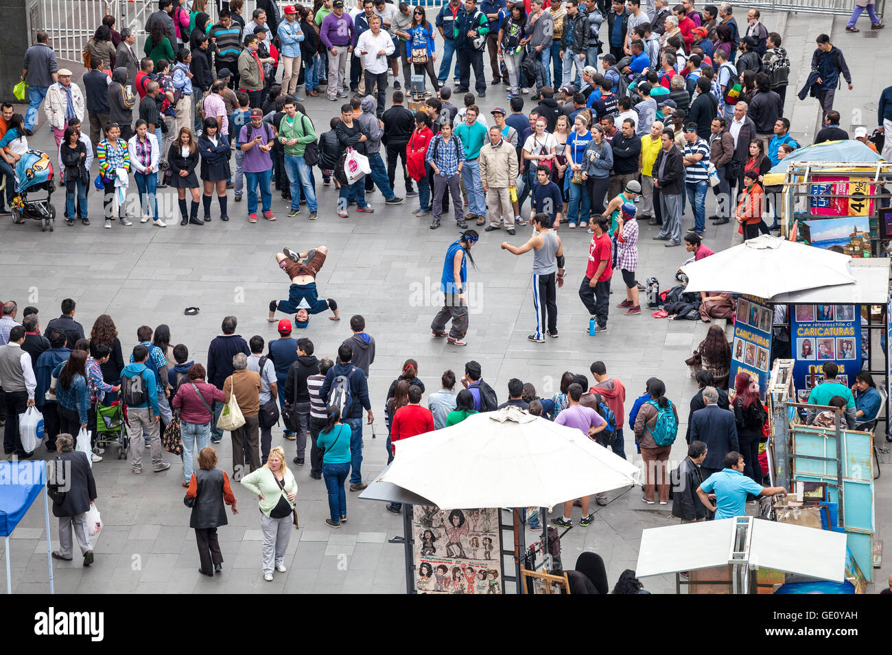 Street artists and people admiring modern dance in center of Santiage de Chile. Stock Photo