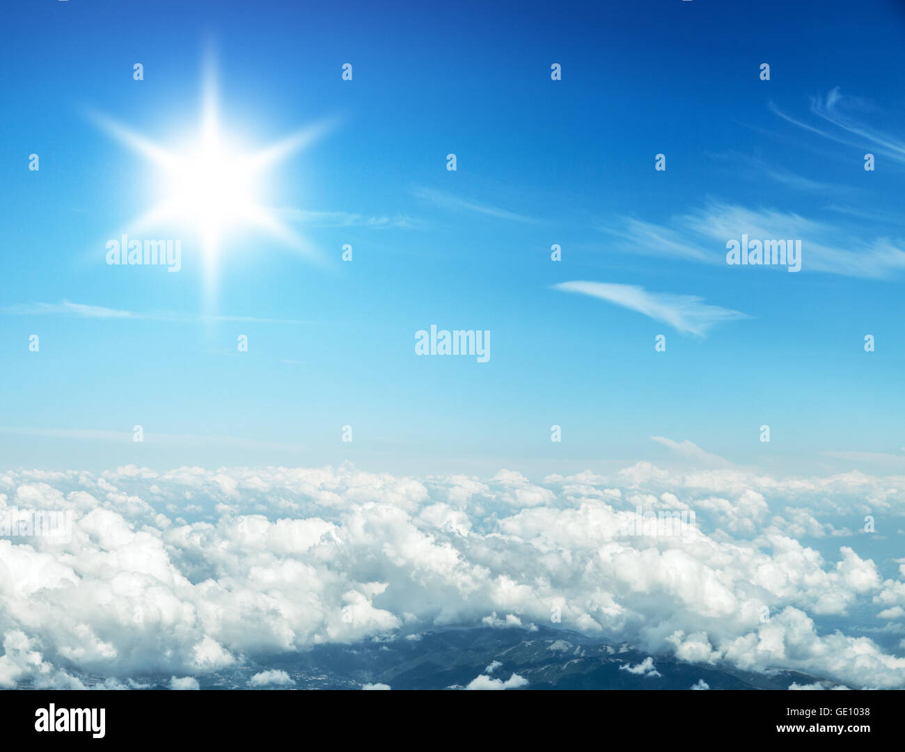 Aerial view of clouds and landscape under them. Stock Photo