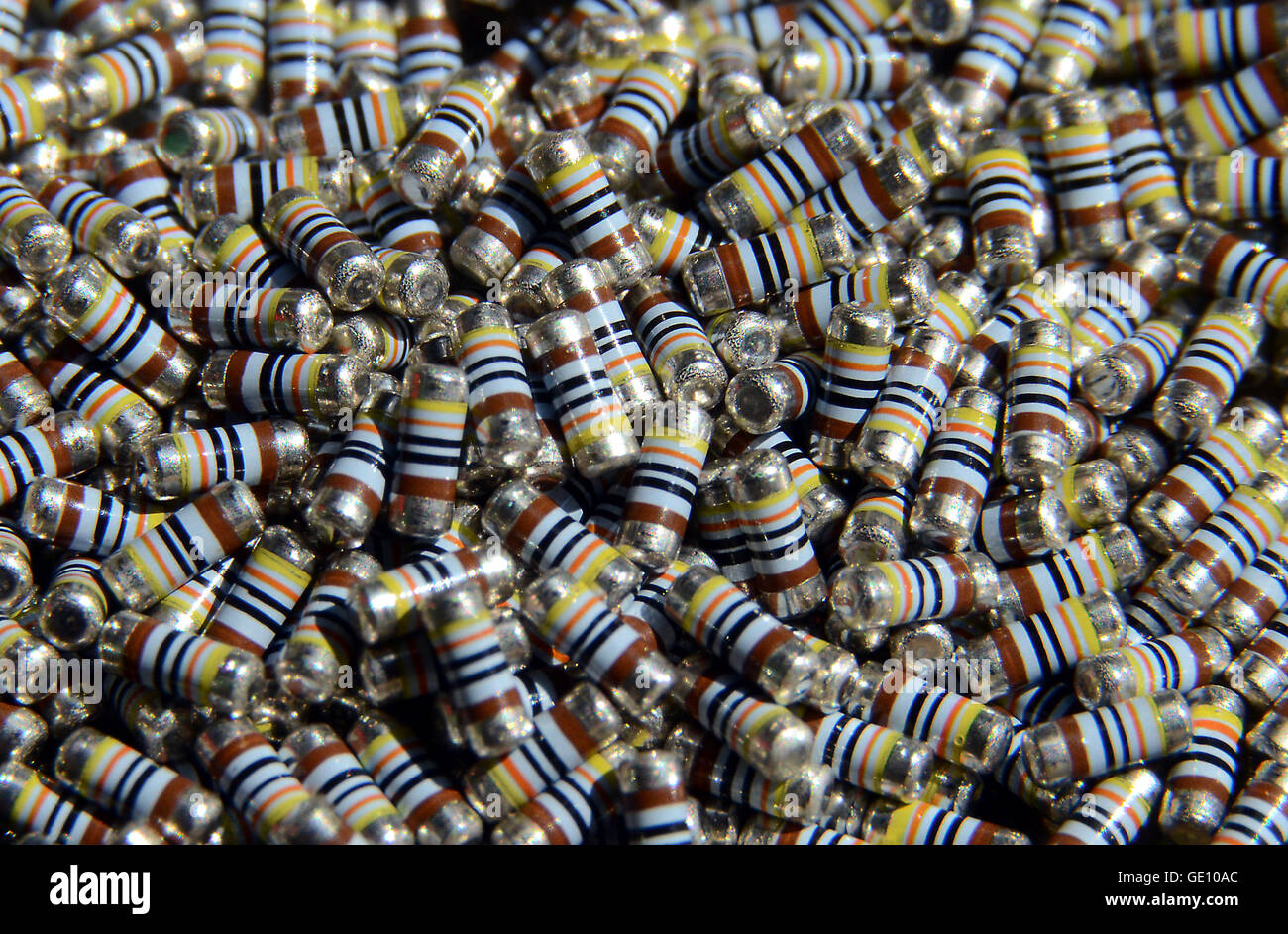 A large number of identical new unused SMD resistors. Or wait, are they all identical? Find the deviant! Stock Photo