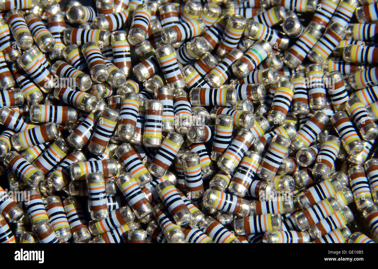 A large number of identical new unused SMD resistors. Or wait, are they all identical? Find the deviant! Stock Photo