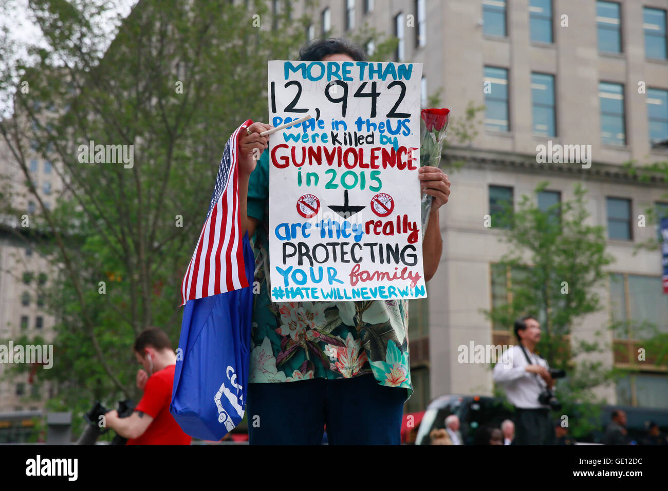 07212016 - Cleveland, Ohio, USA:  A protester holds an anti gun sign on the final day of the 2016 Republican National Convention in downtown Cleveland. (Jeremy Hogan) Stock Photo