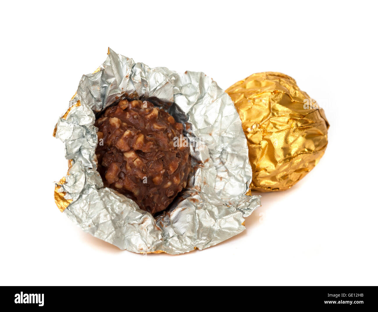 Chocolate balls with almond  in a gold foil paper. Stock Photo