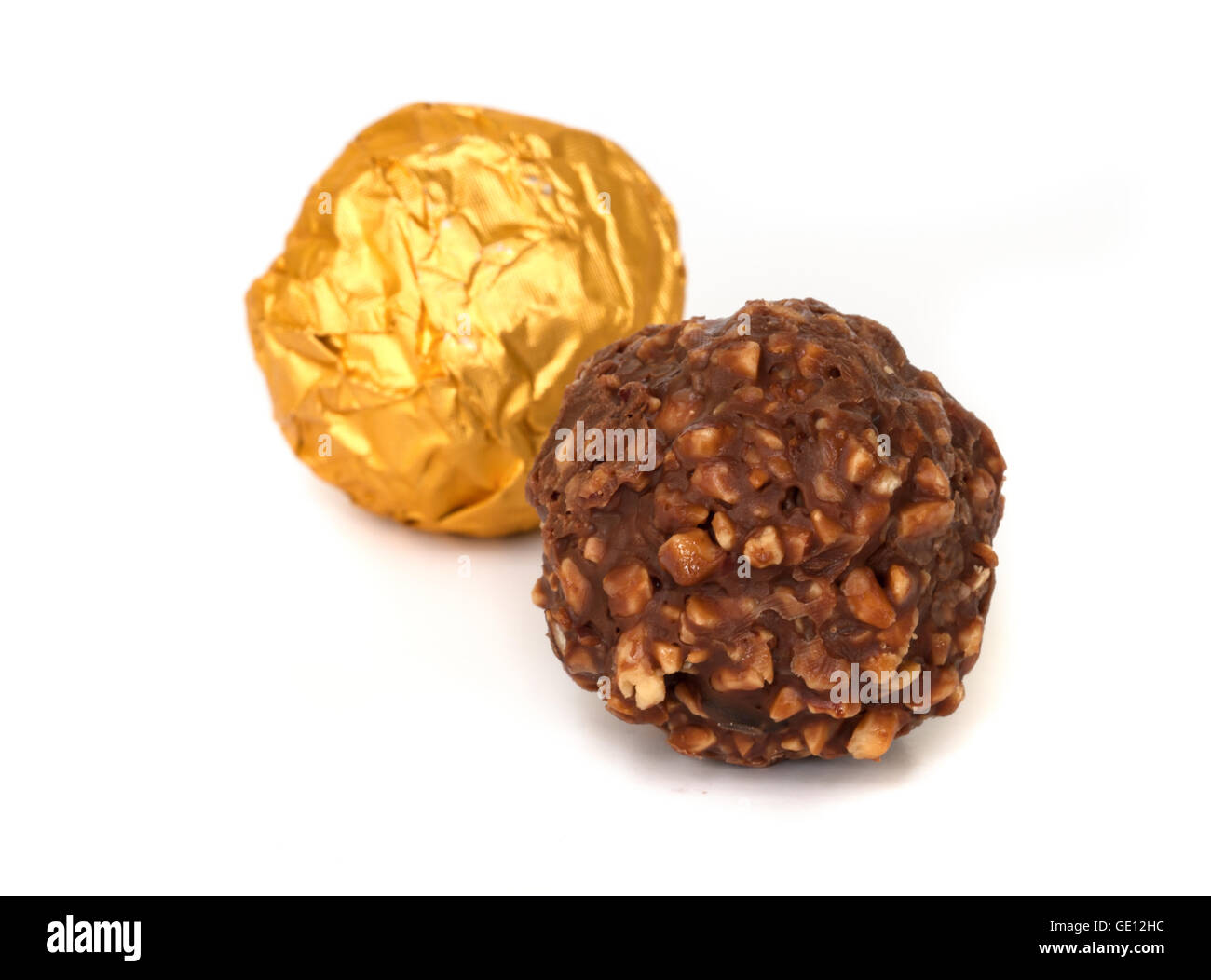 Chocolate balls with almond  in a gold foil paper. Stock Photo