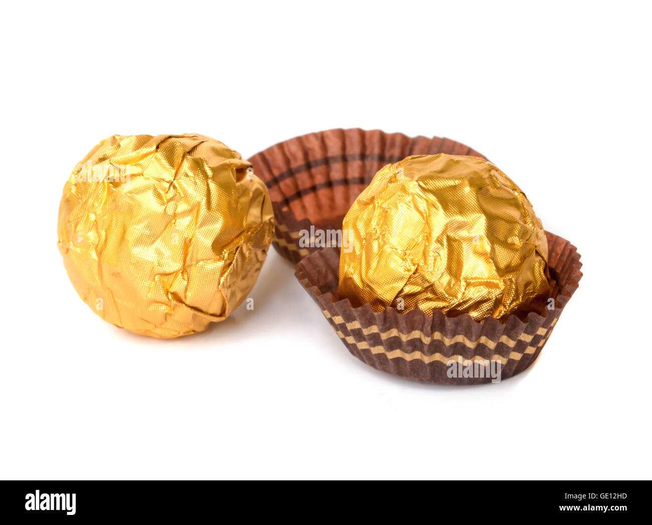 Chocolate balls with almond  in a gold foil paper. Stock Photo