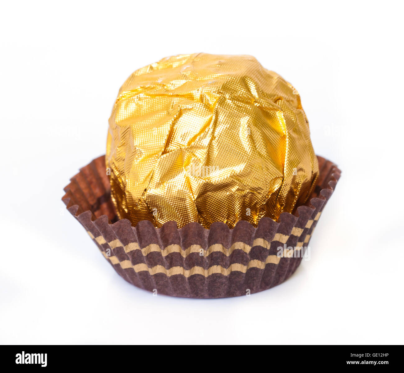 Chocolate Ball In Rapper Chocolate ball with almond in a gold foil paper Stock Photo - Alamy