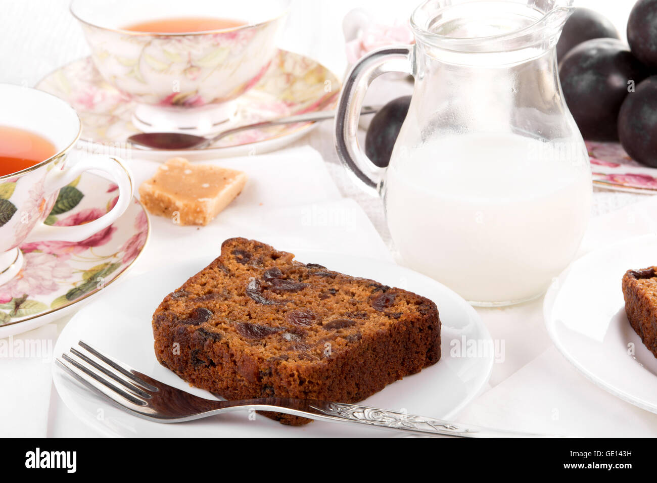 Tea served with traditional British fruit cake Stock Photo