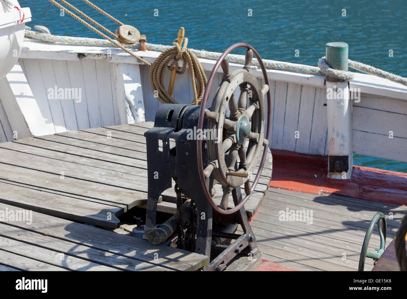 Old wooden wheel on old sailing ship at Amerikakaj in the northern part of Copenhagen Harbour. Stock Photo