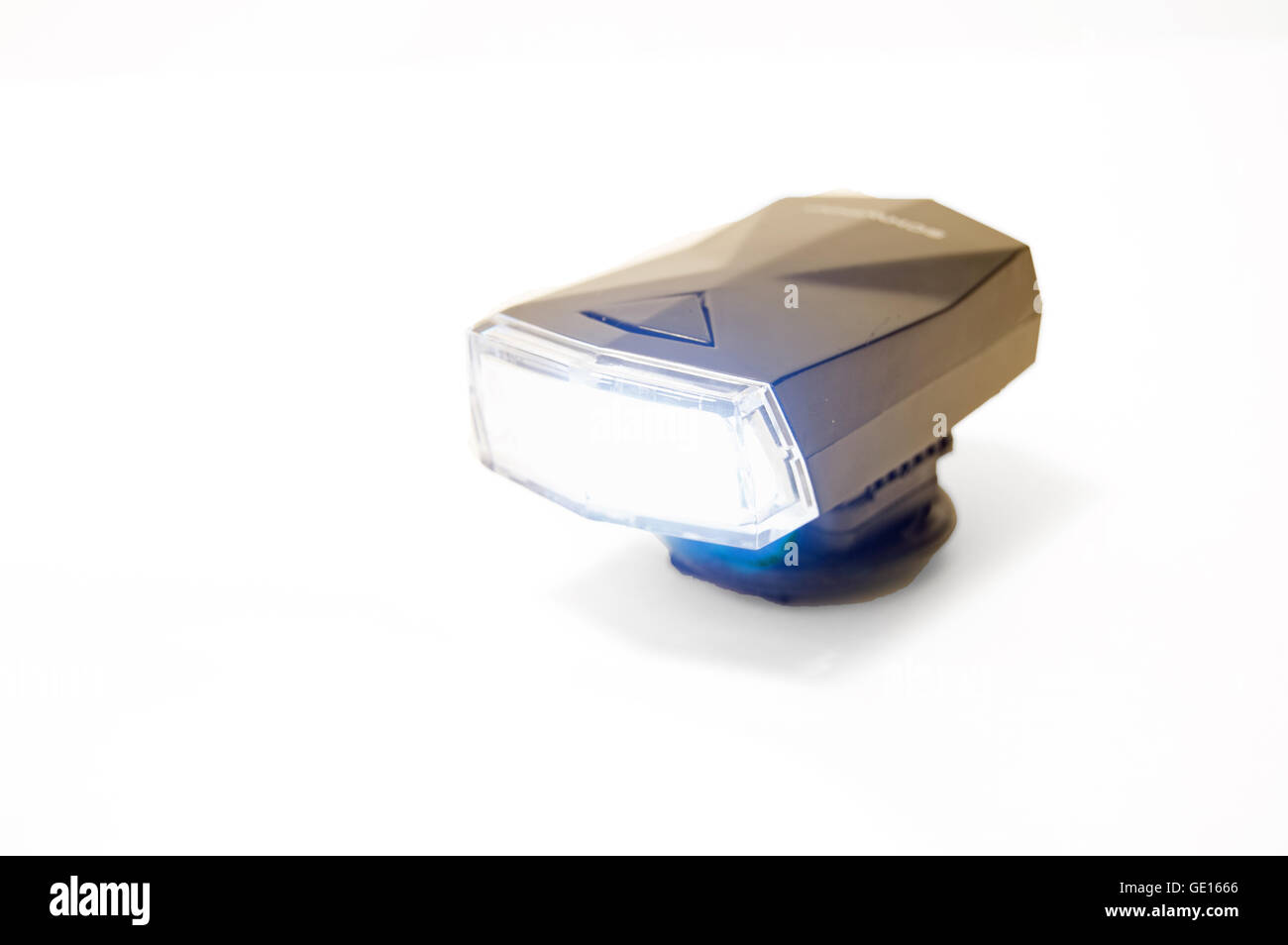 A black bicycle headlight turned on a white background Stock Photo Alamy
