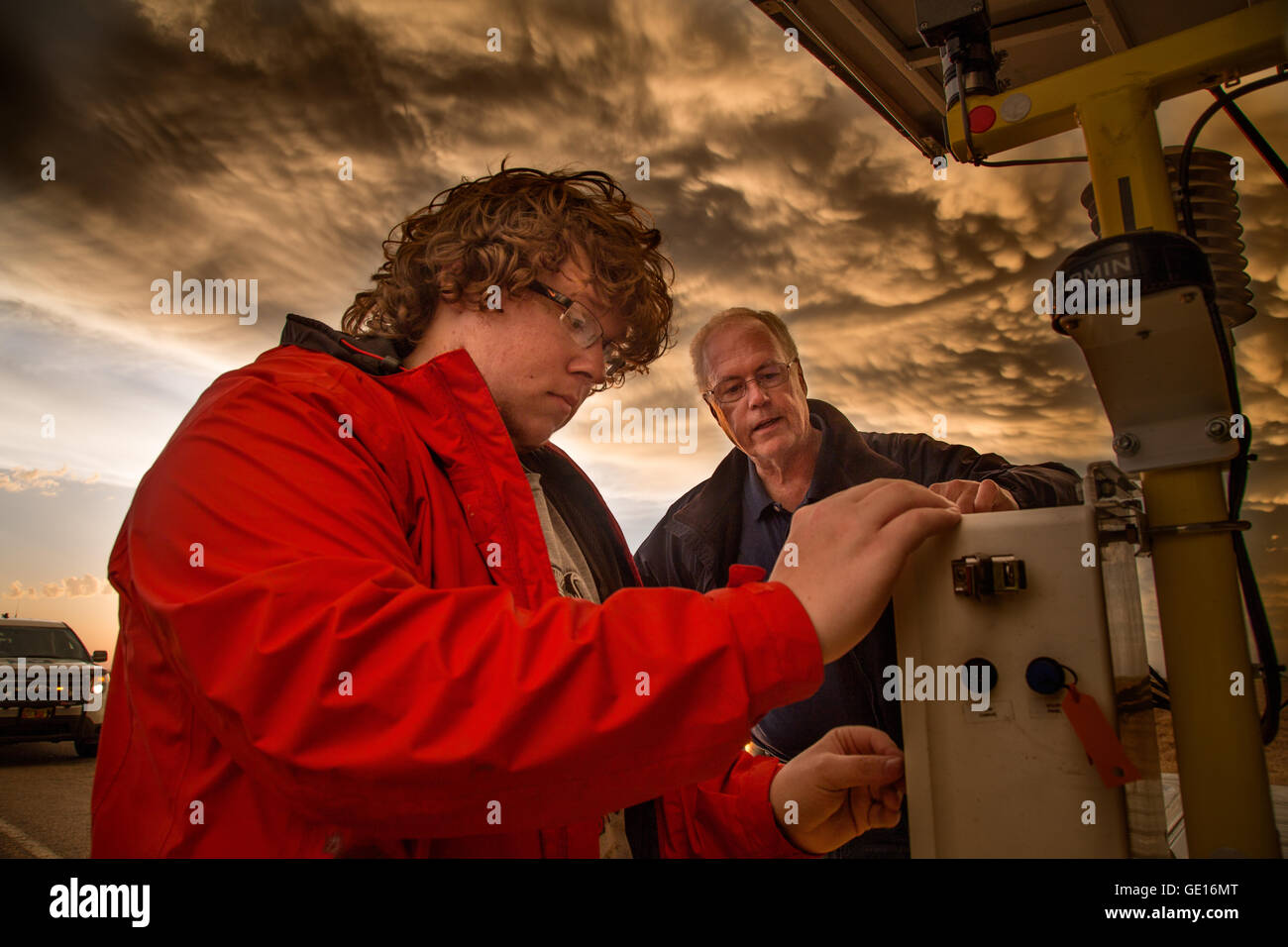 Storm Chasers Brandon Molyneaux and Tim Marshall examine a tornado pod after it was struck by a tornado near Dodge City, Kansas, May 24, 2016. Stock Photo