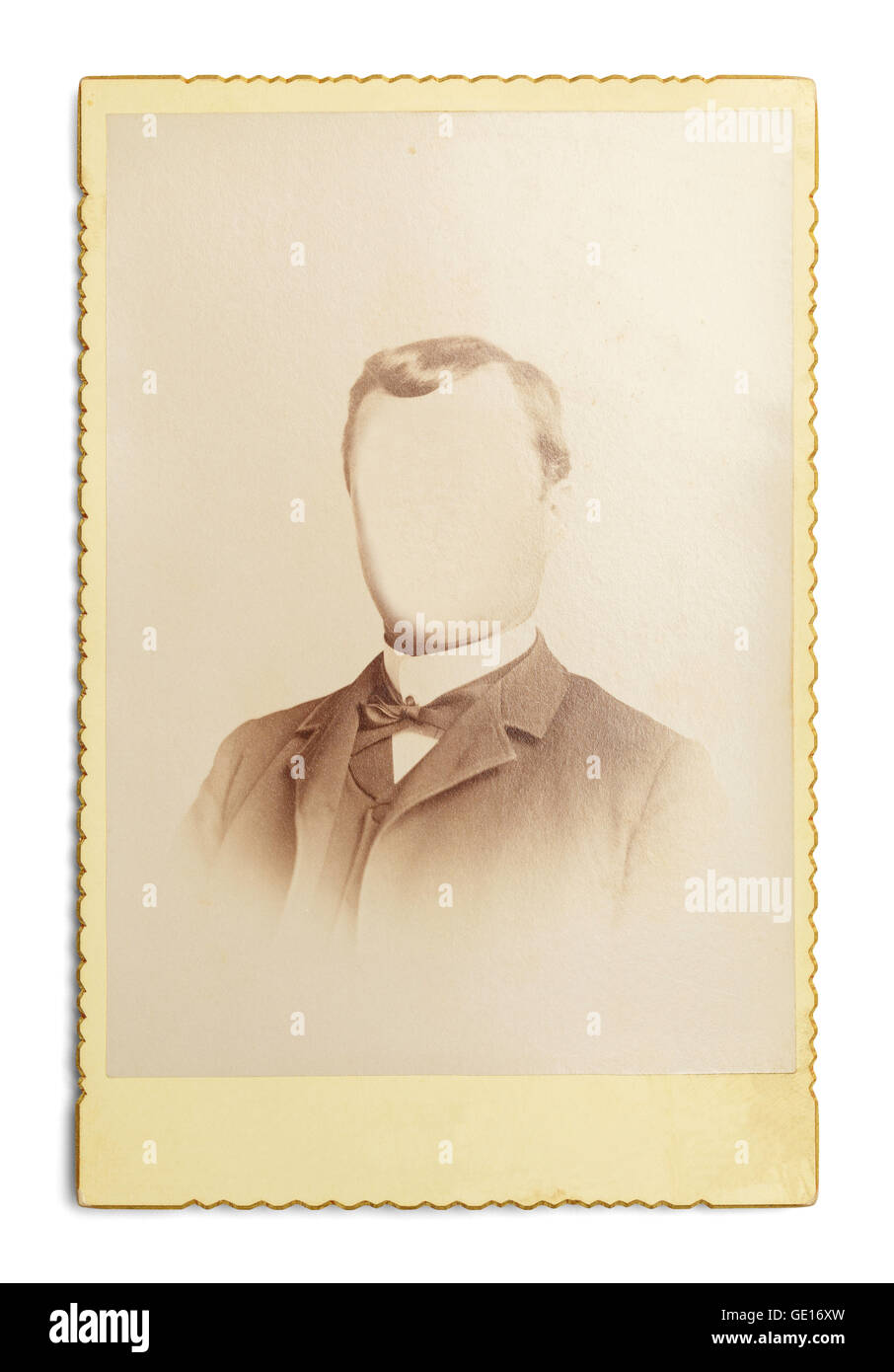 Old Antique Photo of Man With Face Cut Out Isolated on White Background. Stock Photo