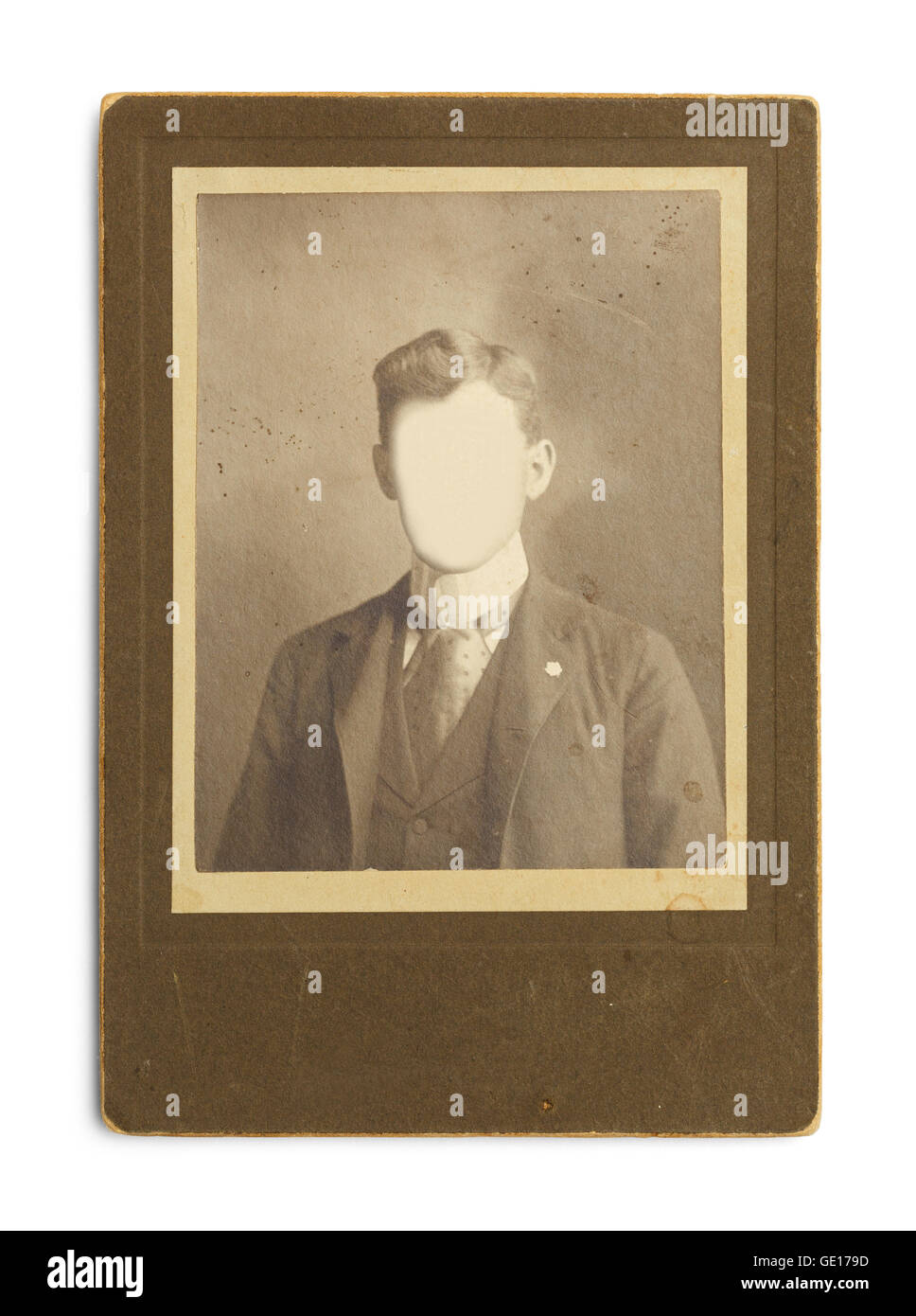 Old Antique Photo of Man With Face Cut Out Isolated on White Background. Stock Photo