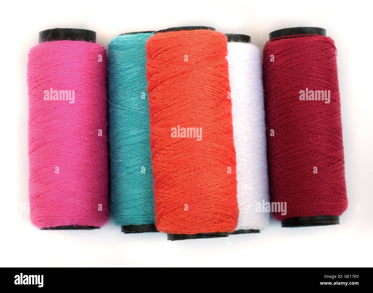Spool of coloured thread isolated on white background Stock Photo - Alamy