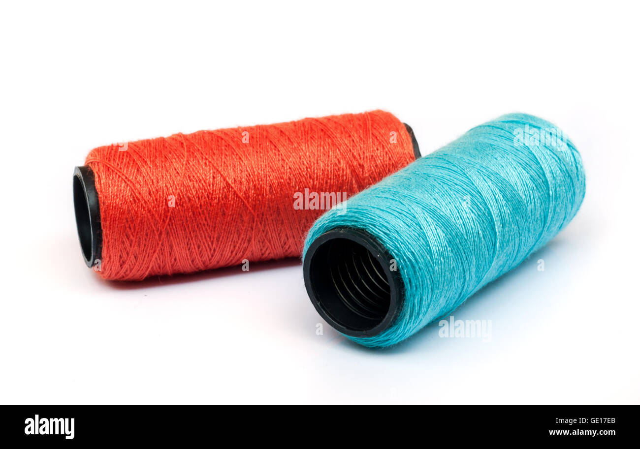 Spool of coloured thread isolated on white background Stock Photo - Alamy