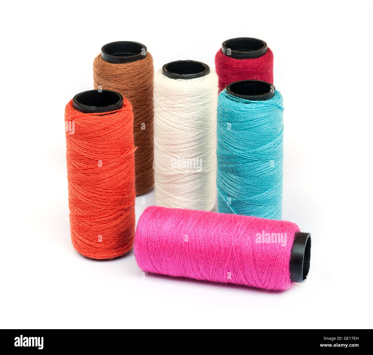 Spool of coloured thread isolated on white background Stock Photo - Alamy