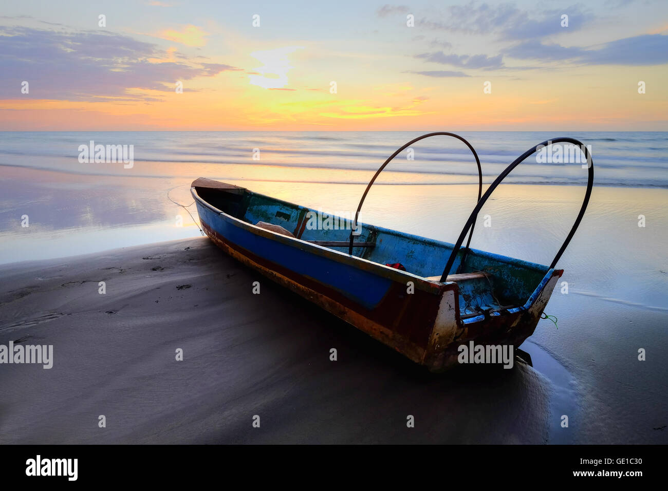 Fishing boat at sunrise on kota kinabalu beach, Sabah, Malaysia Stock Photo