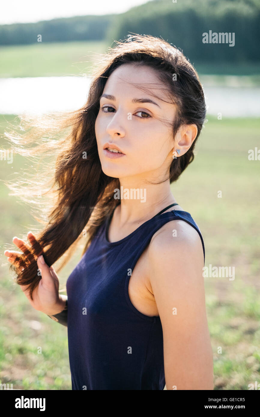 Portrait of a woman standing in field Stock Photo - Alamy