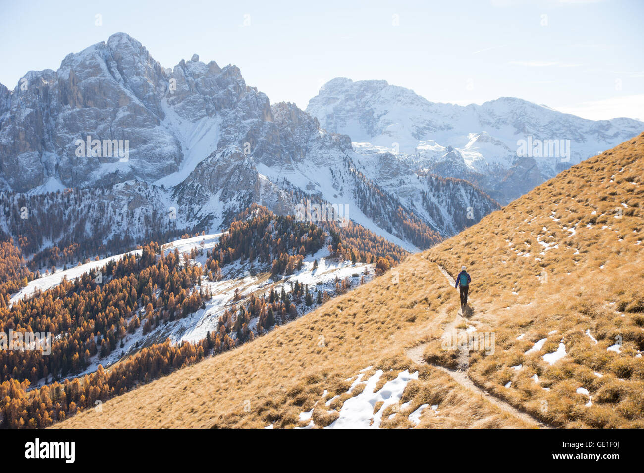 Woman hiking in the Dolomite Mountains, South Tyrol, Italy Stock Photo