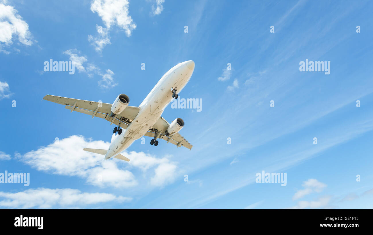 Low angle view of an aeroplane flying mid air, Lanzarote, Canary Islands, Spain Stock Photo