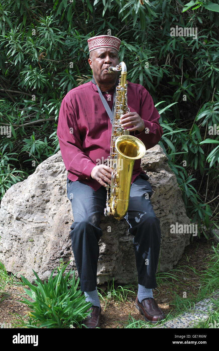 Jazz musician playing his saxophone. Stock Photo