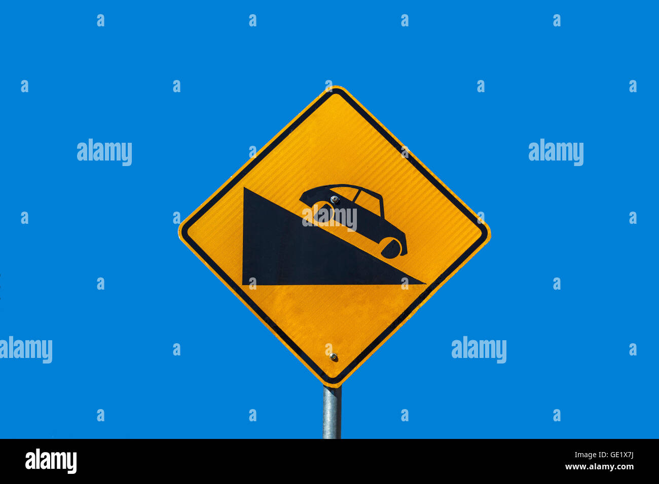Road sign warning of steep hill ahead Stock Photo