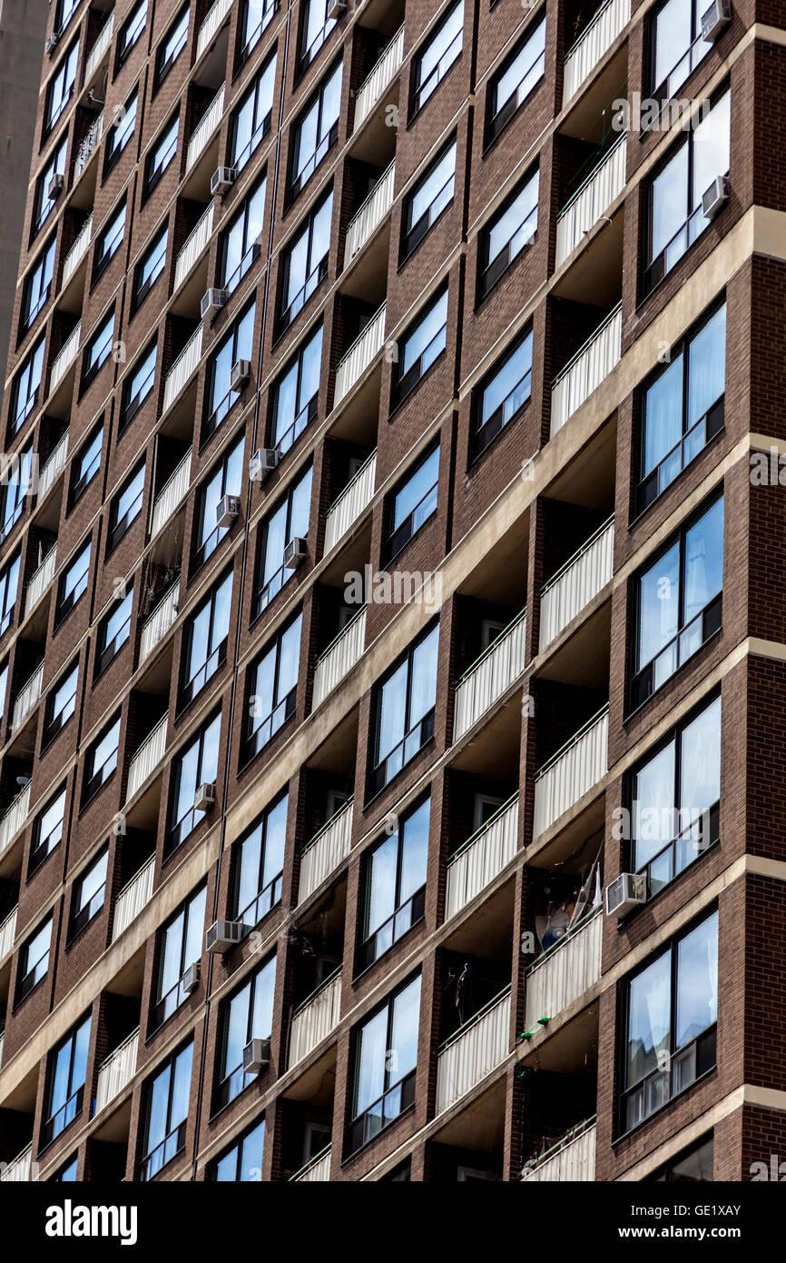 Windows in high-rise residential apartment block Stock Photo