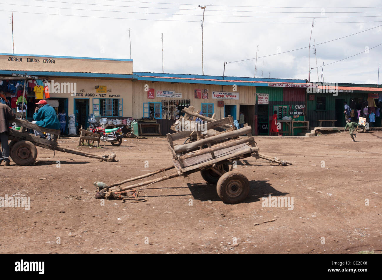 A typical market place scene with vegetable vendors hair salons laundry stores in towns and villages across Kenya Stock Photo