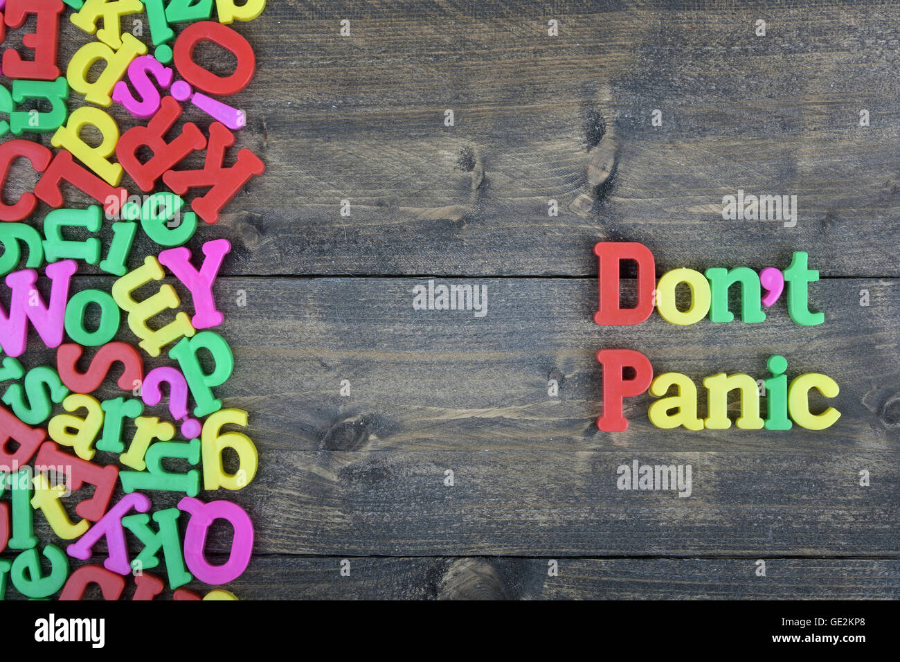 Don't panic word on wooden table Stock Photo