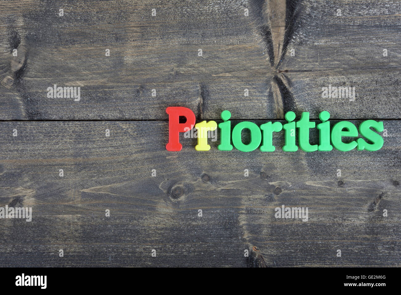 Priorities word on wooden table Stock Photo