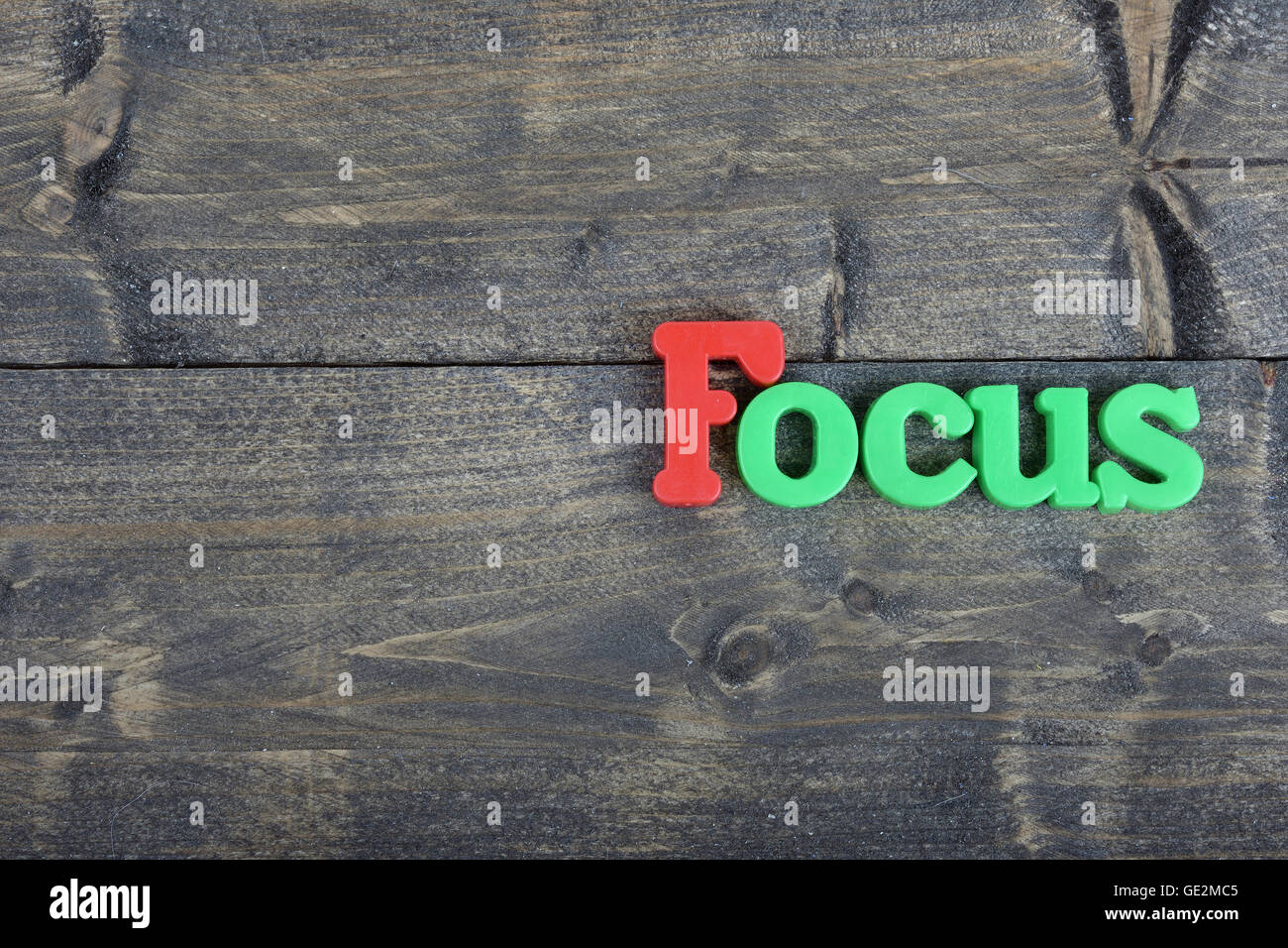 Focus word on wooden table Stock Photo