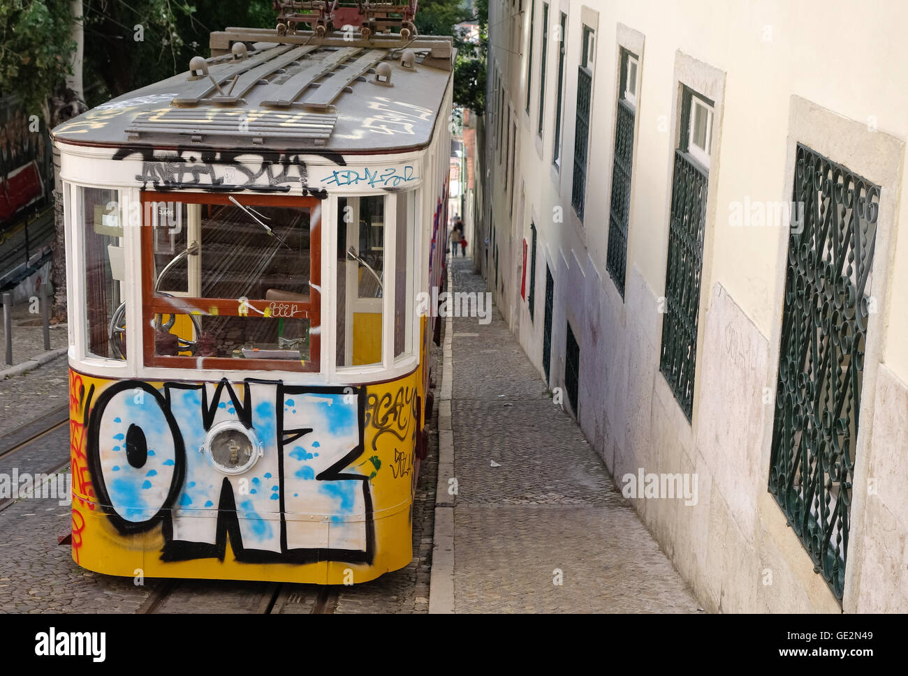 Lisbon, Portugal - September 19, 2014: Tram, the symbol of the city in narrow street of Lisbon. Stock Photo