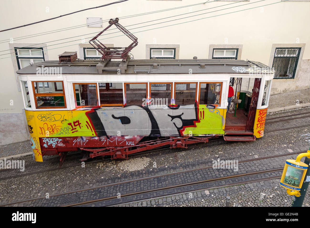 Lisbon, Portugal - September 19, 2014: Tram, the symbol of the city in narrow street of Lisbon. Stock Photo