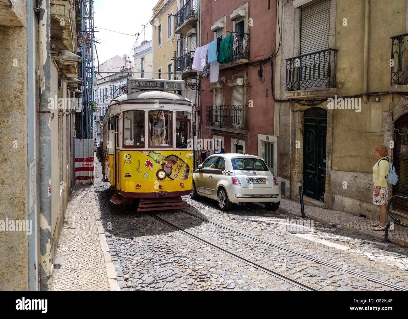 Lisbon, Portugal - September 19, 2014: Tram, the symbol of the city in narrow street of Lisbon. Stock Photo