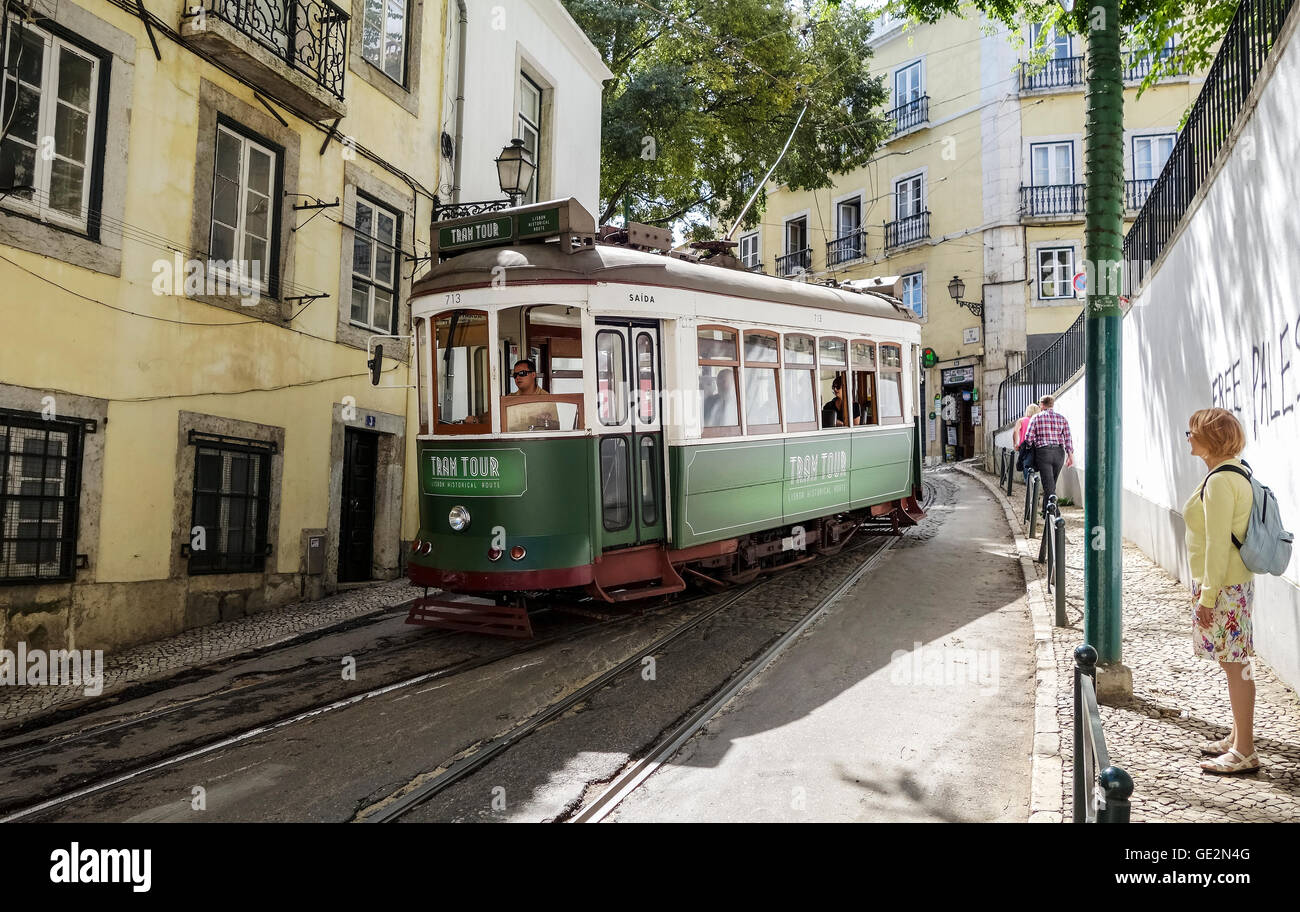 Lisbon, Portugal - September 19, 2014: Tram in narrow street of Lisbon. Tram is the symbol of the city. Stock Photo