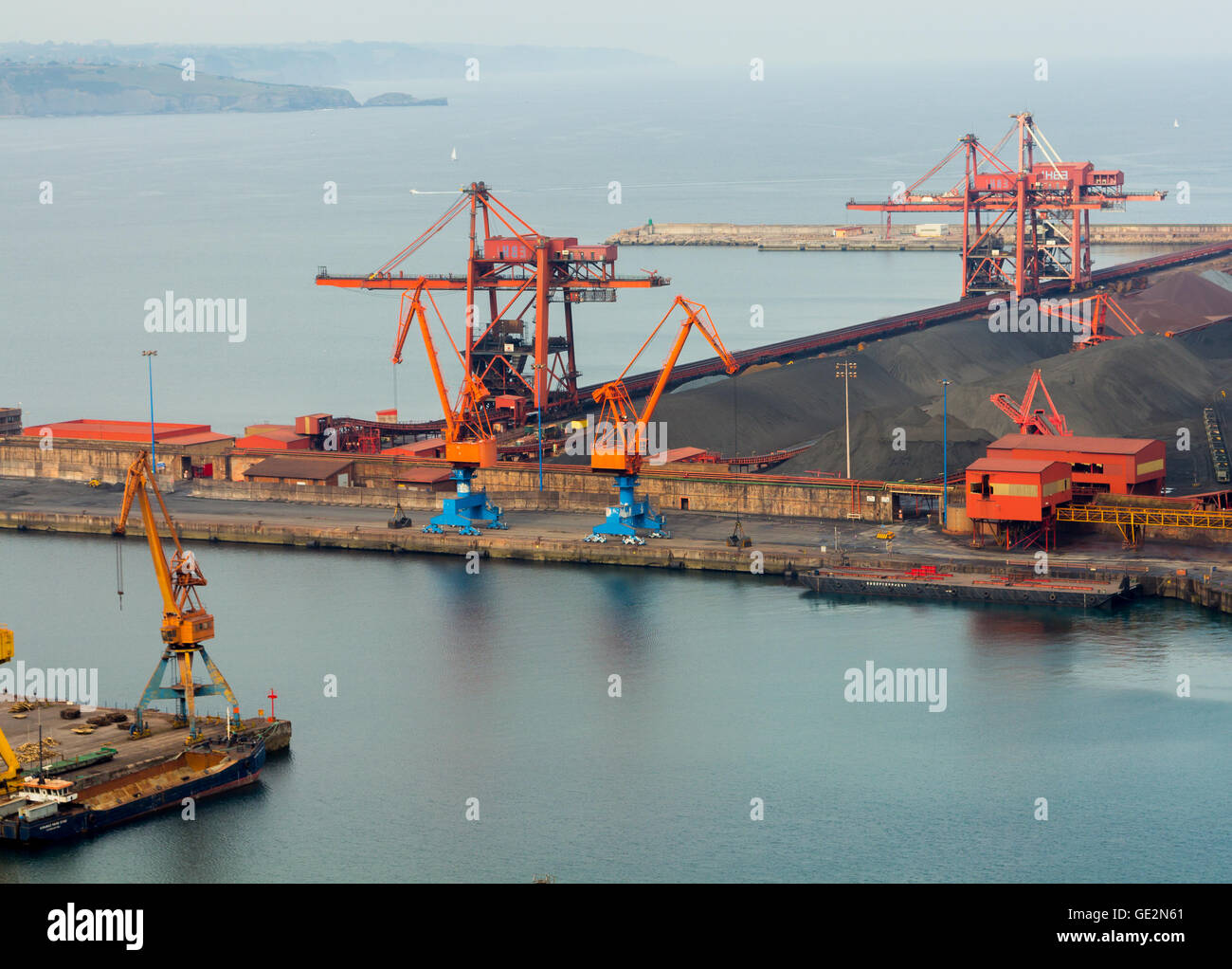 Huge cranes at a port charge Stock Photo
