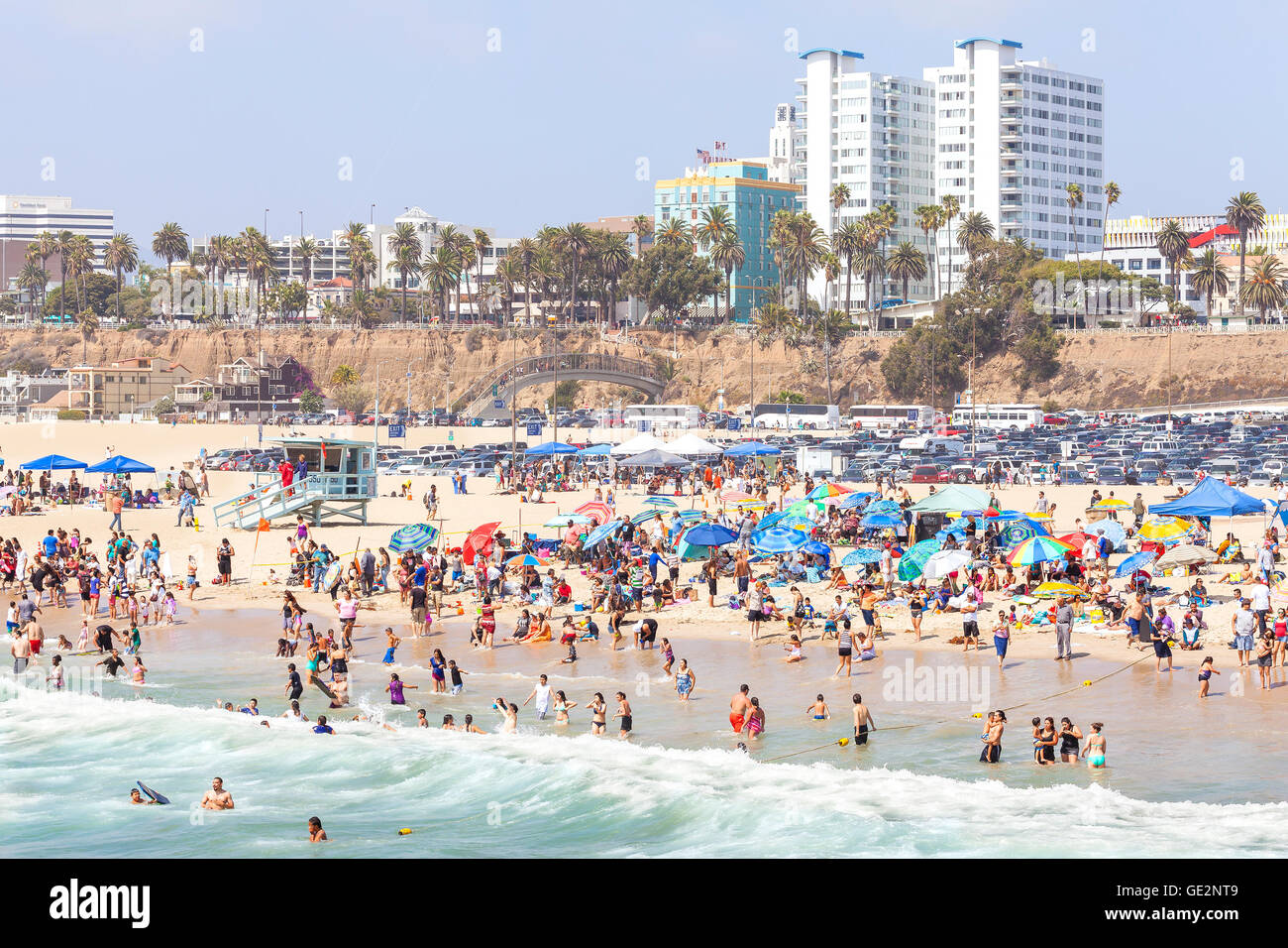 Santa Monica Beach crowded with people during peak season. Stock Photo