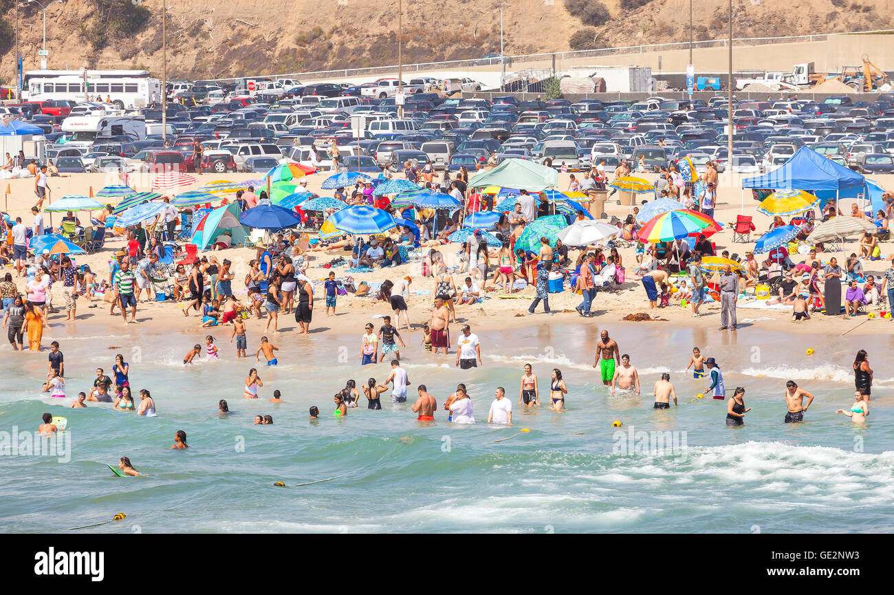 Beach full of people during peak season in Santa Monica. Stock Photo