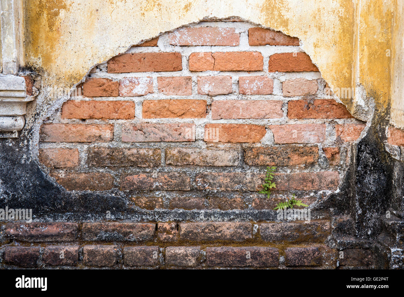 Grunge wall cracks of the old house. Textured background Stock Photo