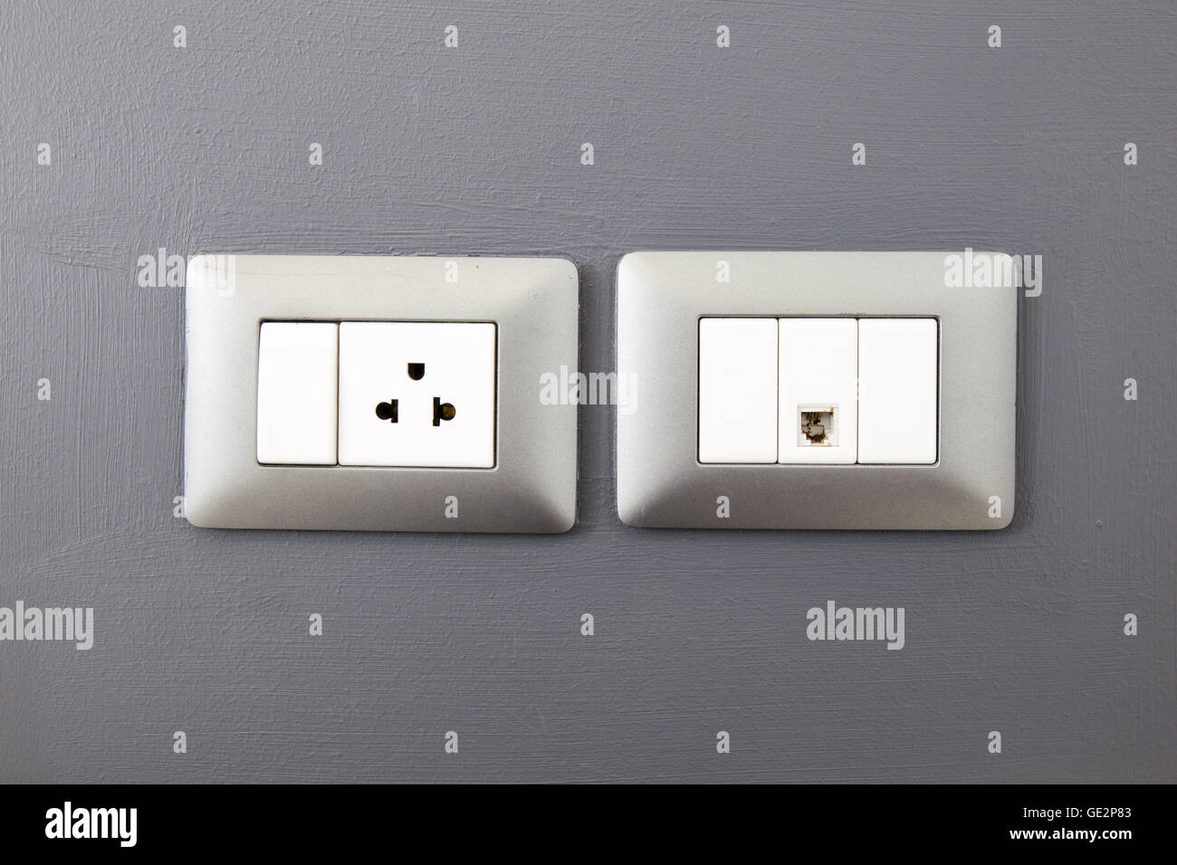 electric plug and network port on wall Stock Photo Alamy