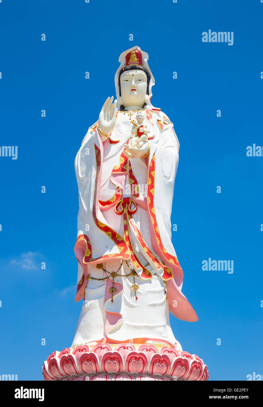 Statue of the Goddess Guanyin on blue sky Stock Photo