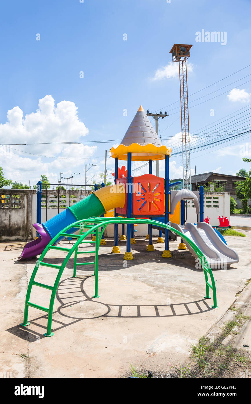 Closeup colorful playground with Prevent injuries yard in park on blue sky background Stock Photo