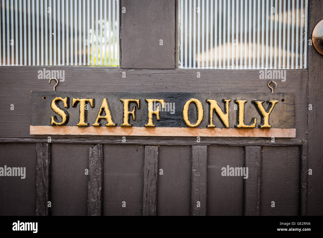 Staff Only Sign on wood door Stock Photo