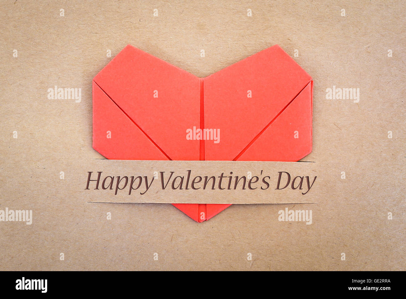 Valentine card, The heart shape paper on brown with 'I love you' label Stock Photo