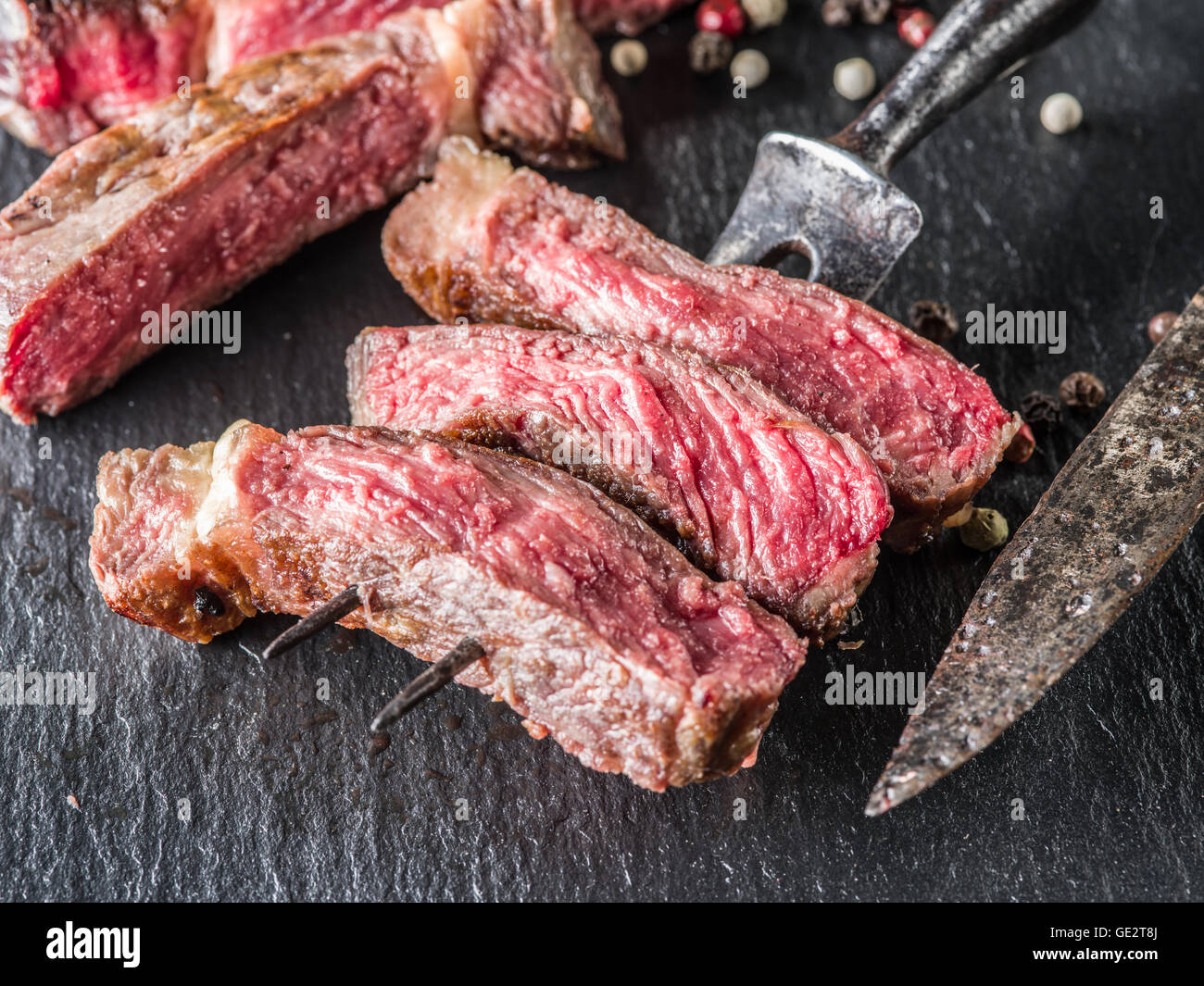 Medium Rib eye steak on the graphite tray. Stock Photo