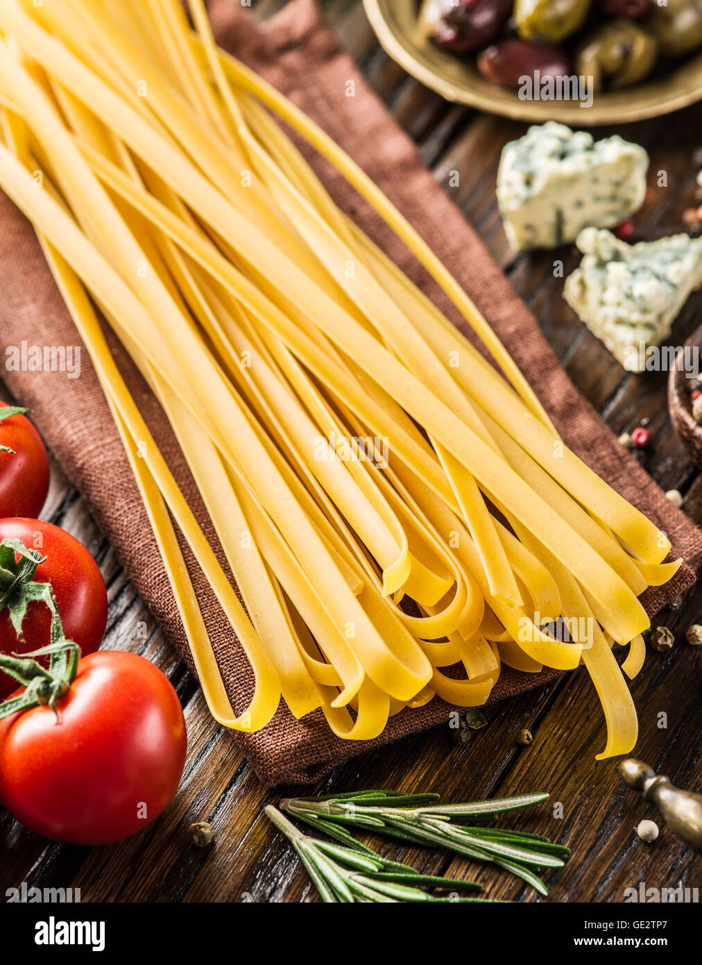 Pasta ingredients. Cherrytomatoes, spaghetti pasta, rosemary and