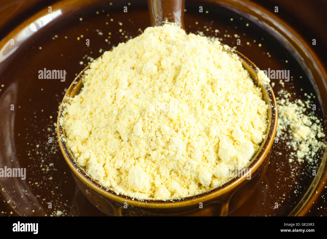 portion of cicer flour in brown bowl Stock Photo