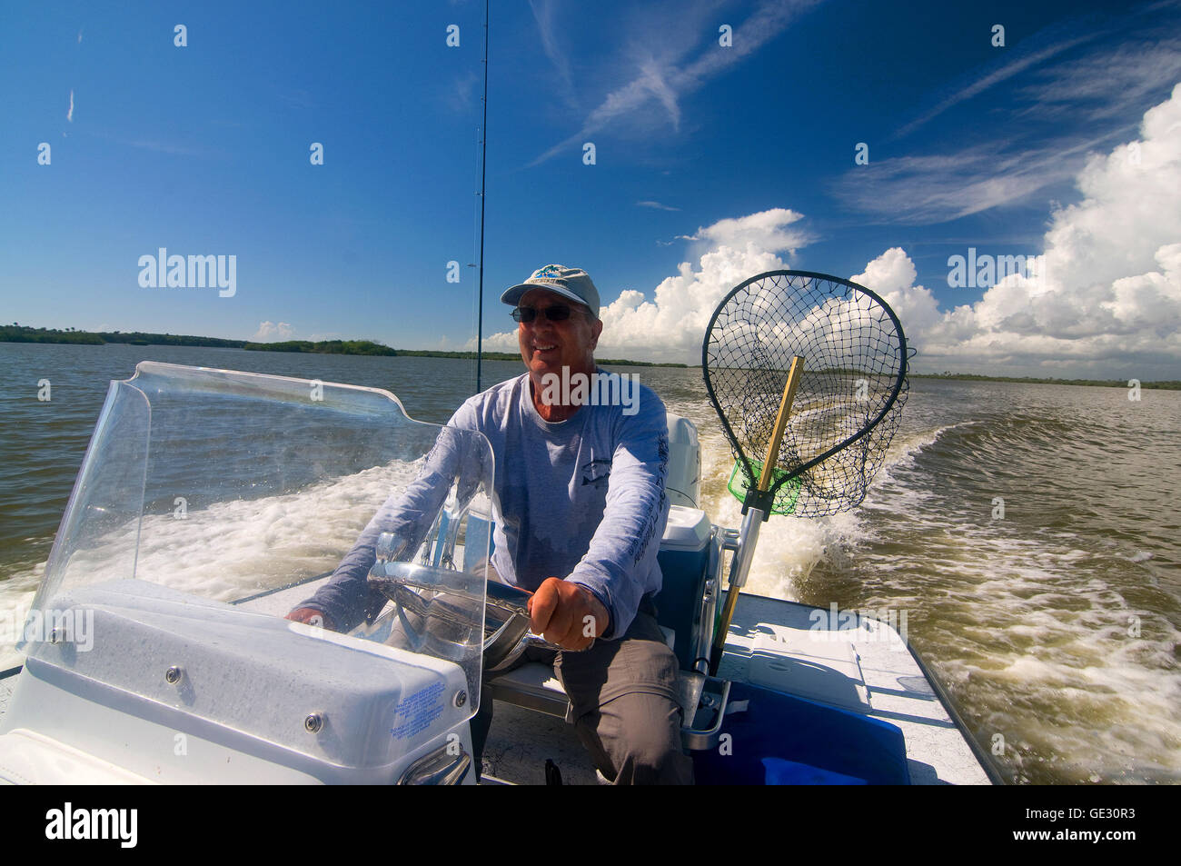 An angler/guide drives his flats boat along Florida's Mosquito Lagoon